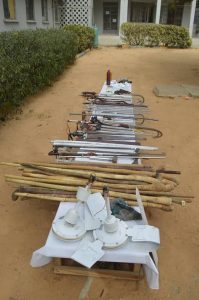 Kano police arrest 13 notorious thugs over attack on senator’s campaign office, recover dangerous weapons, illicit drugs, charms